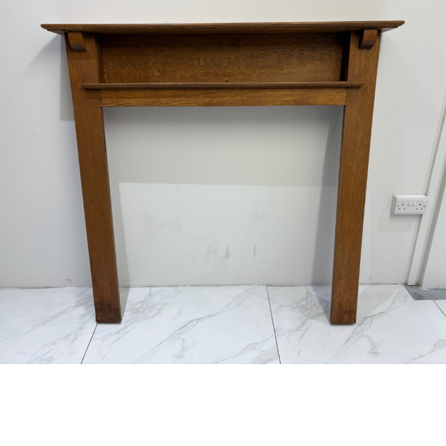A simple, yet stylish oak fireplace surround with mantle shelf above a further inset shelf - VIN1250S